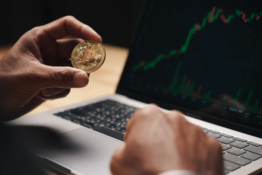 businessman holding bitcoin