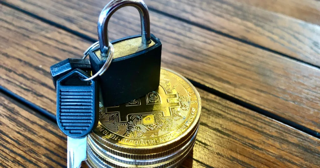 Physical padlock securing Bitcoin stack, symbolizing Crypto Regulation